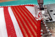 Load image into Gallery viewer, Creative Feet snowman mug rug close up photo of the pearls & piping foot sewing pearls on edge of satin stitching stitched with the Satinedge foot.