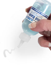 Load image into Gallery viewer, Liquid Baste fabric basting glue bottle being used