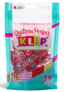 Pink color plastic and metal Quilter's Perfect Clip for fabric with seam guide lines