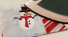 Load image into Gallery viewer, Creative Feet snowman mug rug being ironed
